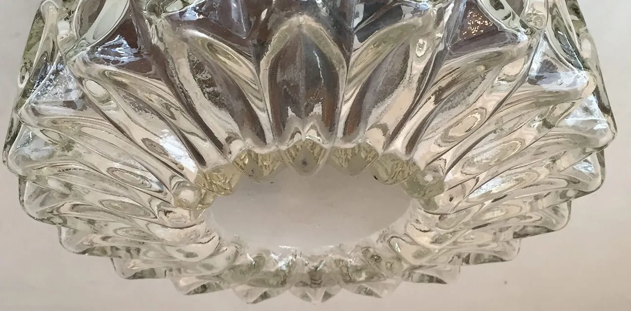 Translucent glass ceiling lights with elegant design in a modern setting.